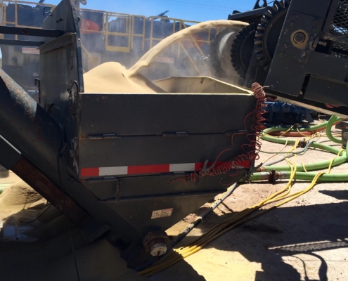 Image of machinery moving sand for fracking