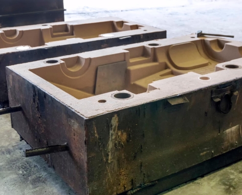 Sand casting mold for metal