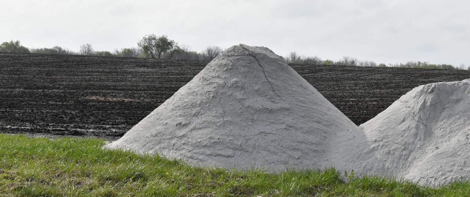Large pile of crushed limestone on farm