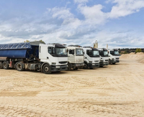 Industrial trucks loading frac sand